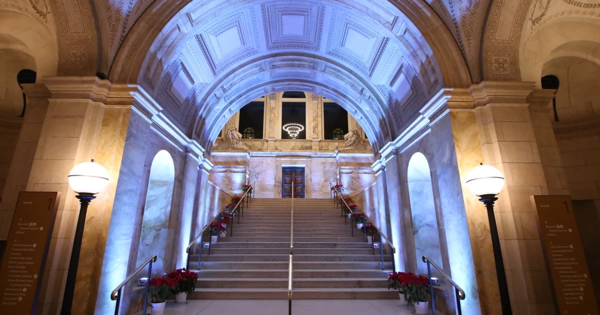 The Boston Public Library's McKim staircase in lavender uplighting