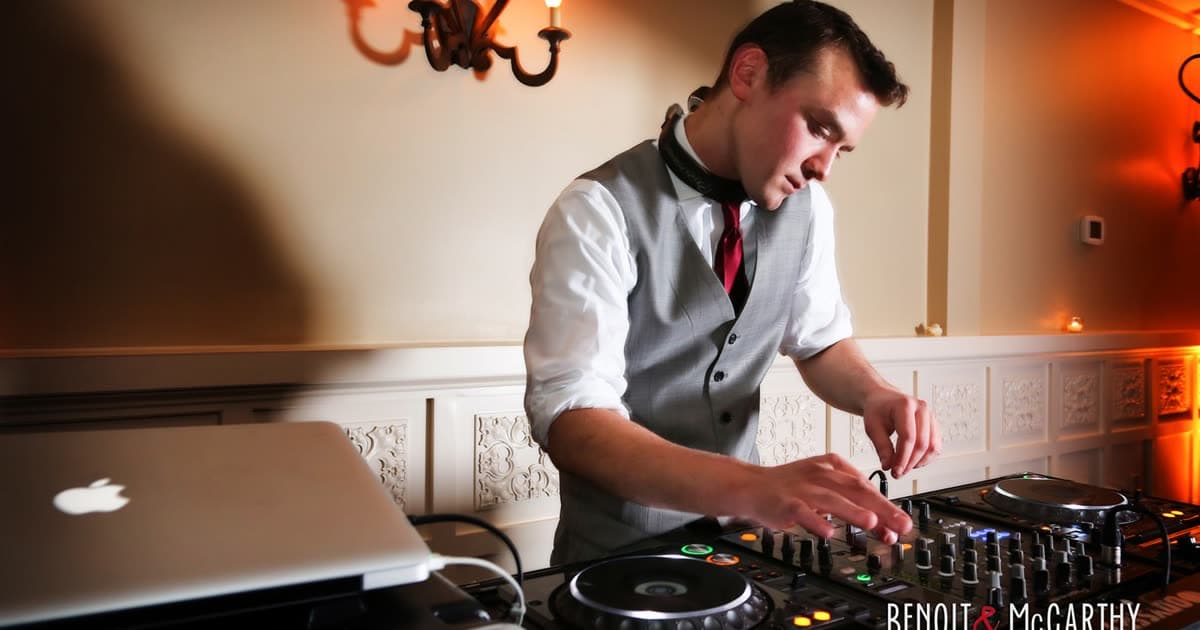 A C-Zone DJ mixing at the decks during a wedding reception
