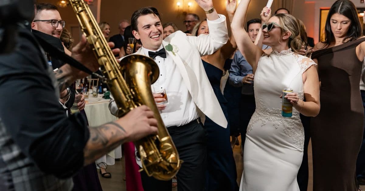 A C-Zone saxophonist playing live over the DJ set on a wedding dance floor