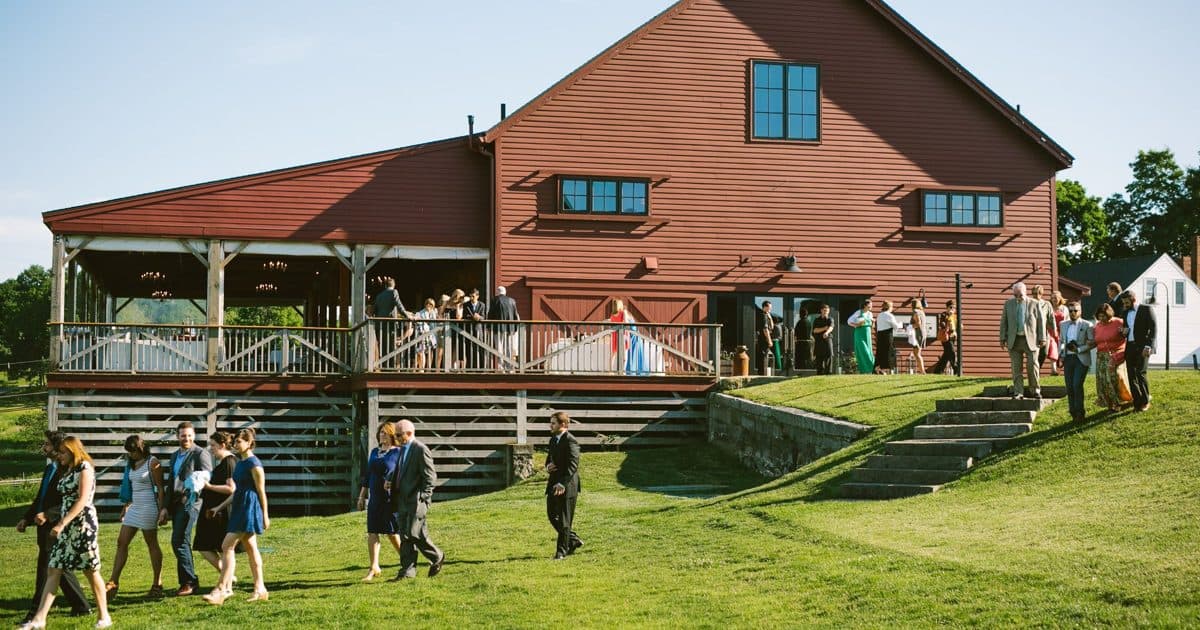 The red Barn at Gibbet Hill with its covered back deck above the lawn
