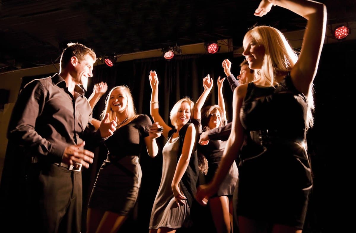 A crowd packed shoulder to shoulder on the dance floor