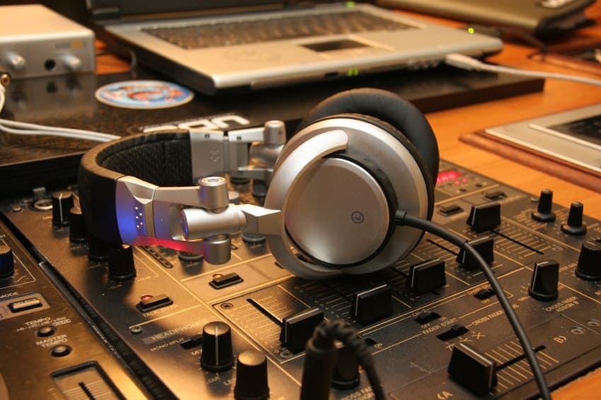 A digital DJ setup with controller and laptop