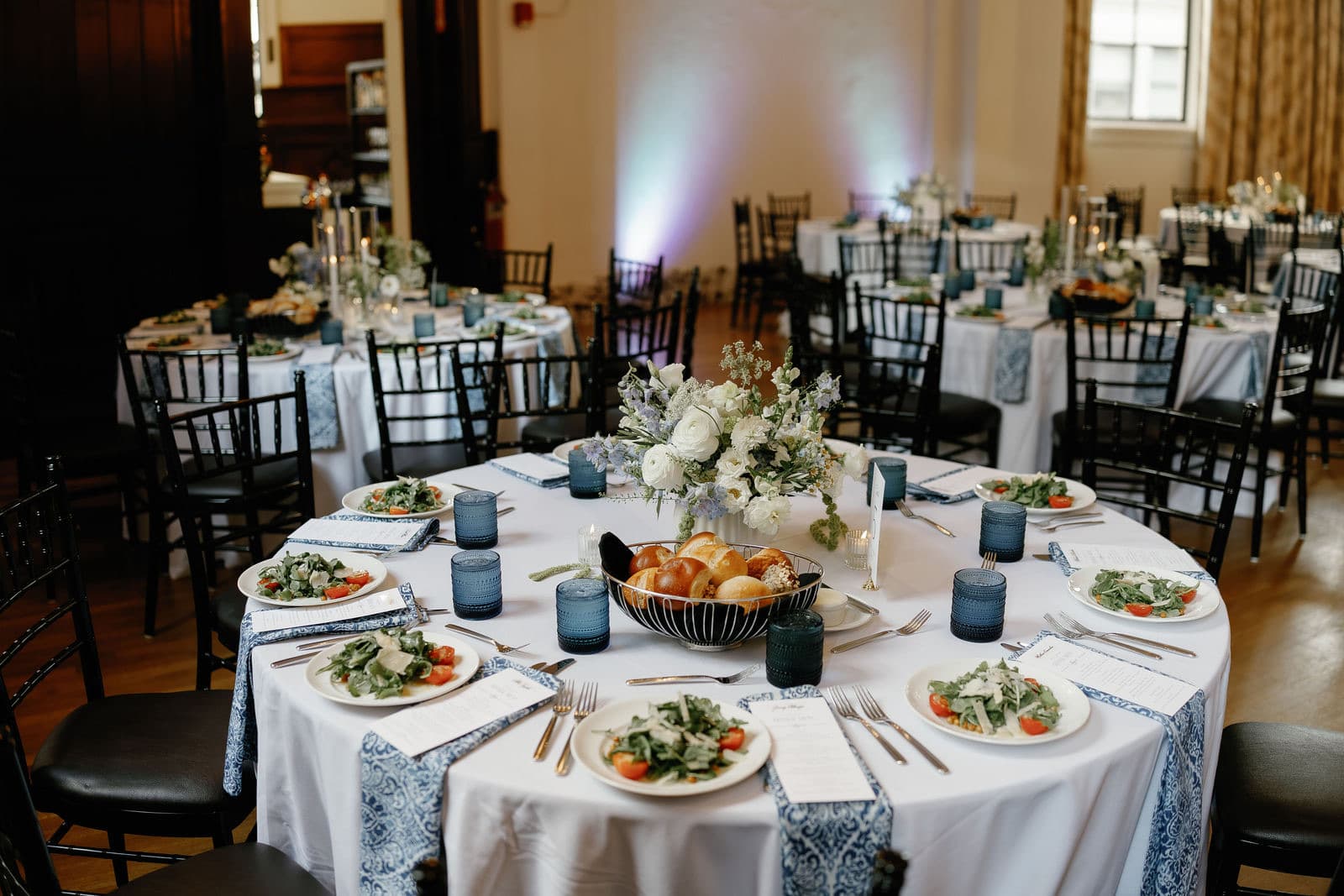 A dinner table at The Tower with the centerpiece and menu cards