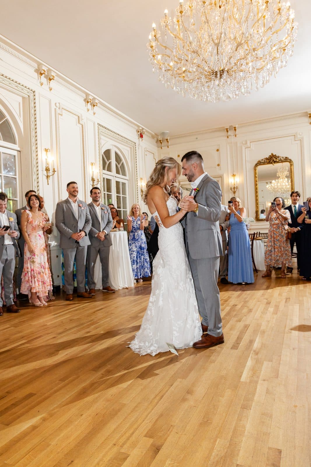 A first dance under the chandelier in the Tupper Manor ballroom, house lights only