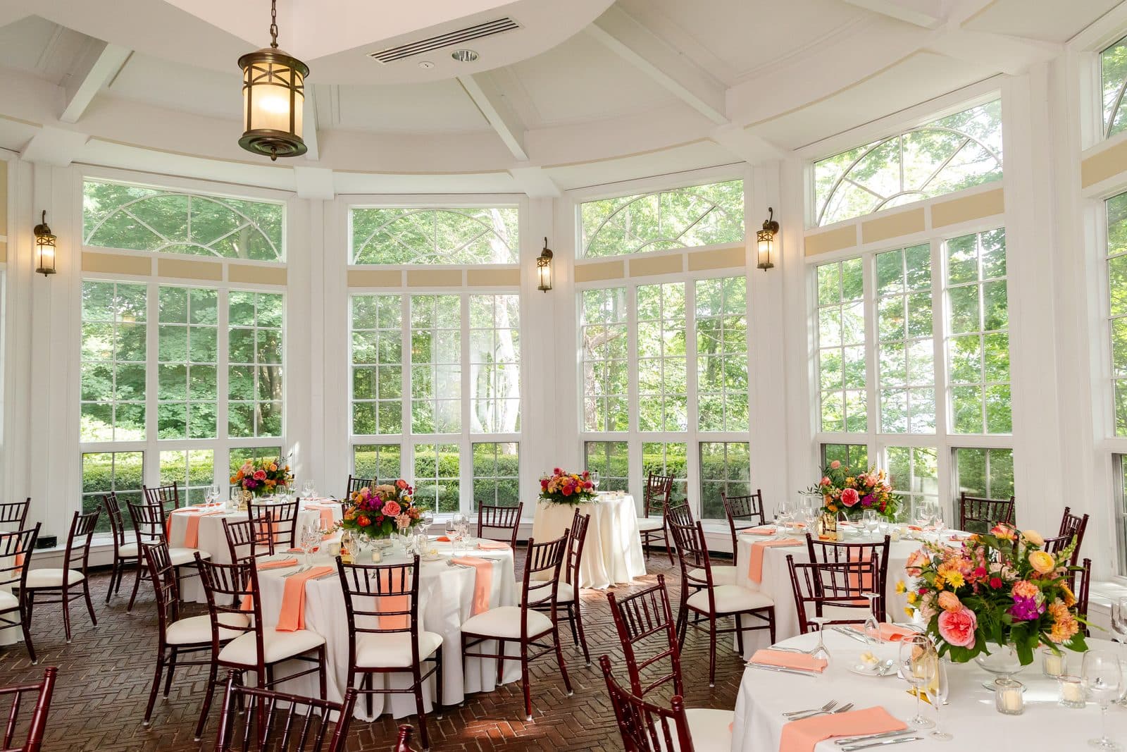 The Tupper Manor conservatory set for dinner, with its curved wall of windows