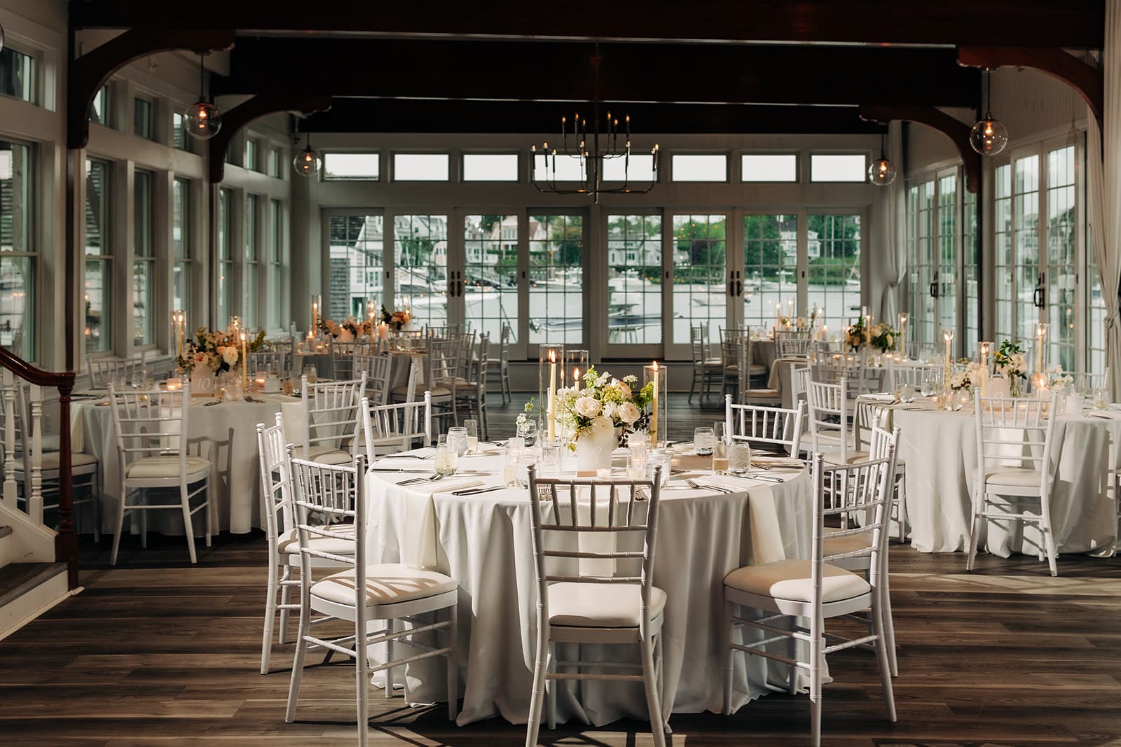 The Harbor Room at Wychmere Beach Club set for dinner in daylight, without uplighting
