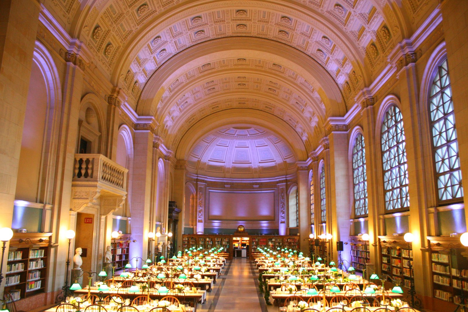 Bates Hall at the Boston Public Library glowing in warm amber uplighting